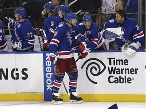 New York Rangers' Michael Grabner, front, celebrates his third goal of the night with teammates during the third period of the NHL hockey game against Tampa Bay Lightning, Sunday, Oct. 30, 2016, in New York. The Rangers defeated the Lightning 6-1.