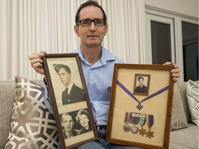 Neil Brown with photos and war medals of his uncle, Allen Ross.