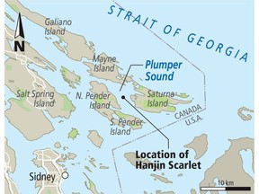 A skeleton crew is manning the Hanjin Scarlet container ship that's hunkered down in Plumper Sound, between North Pender and Saturna islands. — Victoria Times Colonist