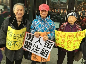 Mrs. Kong, Mrs. Luu, and Ms. Chan protest Vancouver's policies toward Chinatown at a press conference Monday outside a new high-end grocery store at Main and Georgia.