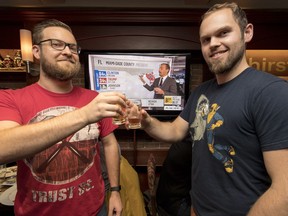 Matthew Czajka and  Brandon Toews were among people taking in the U.S. election results at Steamworks Brewing Co. in Vancouver.