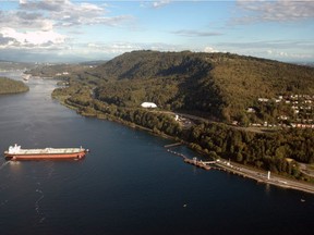 Oil Tanker under tug control prepares to berth, 2004, at the Westridge Marine Terminal in Burnaby. TransMountain, Kinder Morgan pipeline. Kinder Morgan. [PNG Merlin Archive]