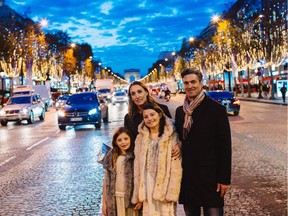 The Bancroft family against the backdrop of the  legendary Christmas lights along the Champs Elysées.