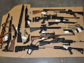 Photo credit: Combined Forces Special Enforcement 2013: Firearms seized by anti-gang police investigating Courtenay resident Bryce McDonald.  Source CFSEU. [PNG Merlin Archive]