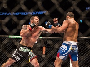 Ryan Bader (left) punches Rafael Feijao during UFC 174 light heavyweight bout at Rogers Arena in Vancouver, B.C. on Saturday June 14, 2014.