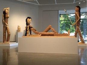 Reclining Figure in foreground, flanked by Goddess on the left and The Hunter on the right, all by Shawn Hunt in Cultural Conflation at Richmond Art Gallery to Dec. 31, 2016. Photo: Kevin Griffin