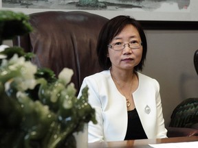 Lawyer Hong Guo poses for a photo in her office in Richmond, BC., November 9, 2016.