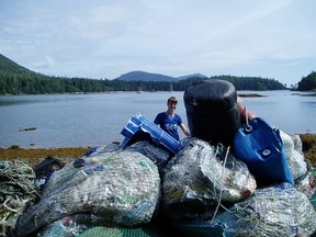 In this undated photo, volunteers clean up the beach at Sea Otter Cove, located near the northwestern end of Vancouver Island. Living Oceans is leading a number of groups in what is billed as the biggest marine cleanup in Canadian history.