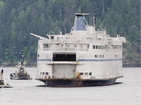 The former Queen of Esquimalt is towed out of Alberni Inlet in 2011, bound for Mexico. The vessel had spent several years moored in Port Alberni while in legal limbo. The sale and scrapping of the ship in Ensenada saved BC Ferries from having to deal with asbestos on board.