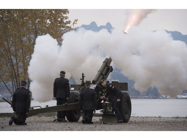 The Lions are seen in the background along the North Shore Mountains as a canon is fired off during the 21 gun salute during Remembrance Day celebrations in Vancouver, B.C., on Friday, Nov. 11, 2016.