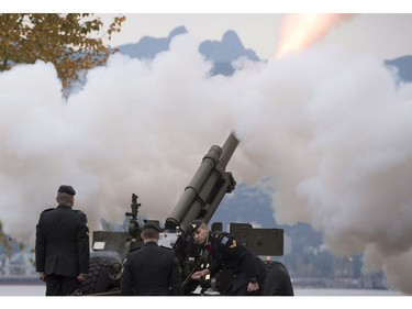 The Lions are seen in the background along the North Shore Mountains as a cannon is fired off during the 21 gun salute during Remembrance Day celebrations in Vancouver, B.C. Friday, Nov. 11, 2016.