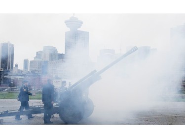 The Vancouver skyline is pictured through smoke as a cannon is fired off during the 21 gun salute during Remembrance Day celebrations in Vancouver, B.C. Friday, Nov. 11, 2016.