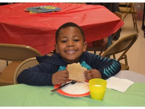 There's plenty to smile about during breakfast at K.B. Woodward Elementary, one of 22 Surrey schools receiving help from Vancouver Sun readers.