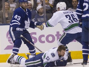 Vancouver Canuck Jannik Hansen comes to the defence of his fallen teammate Daniel Sedin — because the NHL sure won’t do it — in tangling with Toronto Maple Leaf Nazem Kadri after the latter’s blindside hit on the Canucks’ star during their Nov. 5 game at Toronto’s Air Canada Centre.
