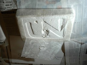 A brick of cocaine with the UN gang's logo pressed into it.