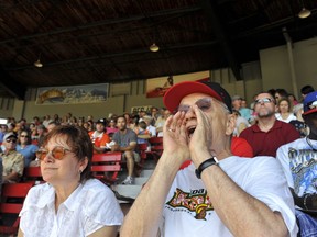 Author/poet/historian — and baseball fan — George Bowering and his writer wife, Jean Baird, take in a Vancouver Canadians game in 2010. The couple, longtime fixtures in Vancouver, lament how their city is becoming ‘monochrome’ and how ‘neighbourhoods are disappearing.’