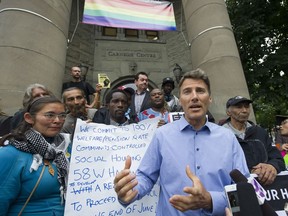 Vancouver Mayor Gregor Robertson speaks outside of Carnegie Centre in 2016 about the city's lack of affordable housing. The city has approved an Empty Homes Tax in a bid to address the shortage of rental space.