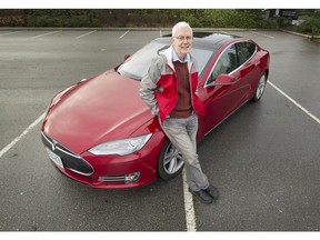 Bruce Sharpe with his Tesla in Surrey on Nov. 15, 2016. Simon Fraser University's Sustainable Transportation Action Research Team (START) released its first 'Canada's Electric Vehicle Policy Report Card,' which gave B.C. a C-minus grade.