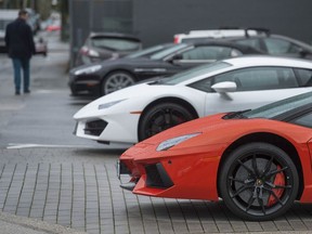 Luxury cars at a dealership off Burrard Street in Vancouver: Those who sell high-end vehicles say they weren't consulted about ICBC's plan to stop insuring them.