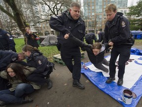 Vancouver police evict people from a tent city set up at Thornton Park in Vancouver.