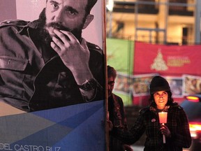 A Fidel Castro supporter attends a candlelight vigil Sunday in Vancouver to commemorate the life of the Cuban revolutionary leader who died Friday. NICK PROCAYLO/PNG