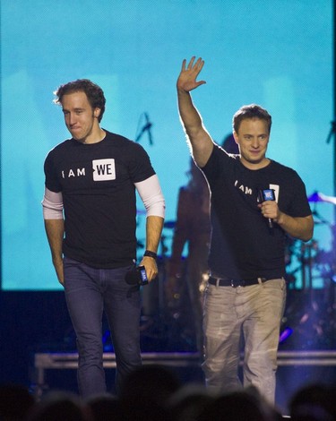 We Day founders Marc and Craig Kielburger appear during the celebrations at Rogers Arena in Vancouver on Thursday.