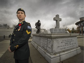 Joe Waugh, 28, at Cloverdale's cenotaph in Surrey.