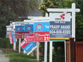 Rows of realtors' signs in the 500 and the 700 block of Renfrew St in Vancouver, BC., November 9, 2016.