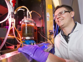 Andrew Carne, shown by a test reactor, helped develop a technology that uses CO2 emissions to treat mine waste.