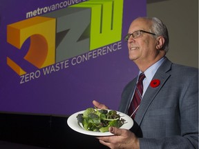 VANCOUVER November 03 2016. Richmond mayor Malcolm Brodie holds a plate of greens from the buffet at the Zero Waste Conference, Vancouver, November 03 2016.