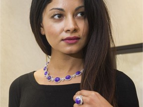 TV Host Zara Durrani tries on lavender jade jewellery at Lao Feng Xiang Jewelry as the store showcases imperial jade, never seen outside of China, in Vancouver, November 25 2016.