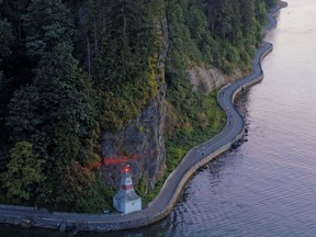 The summer evening is warm and a buzz can be felt along Vancouver's sun-drenched Stanley Park Seawall. An aerial view of the Stanley Park seawall.
