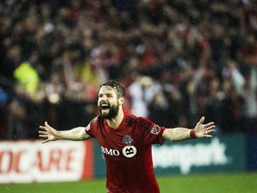 Toronto FC defender Drew Moor (3) reacts after defeating the Montreal Impact during overtime MLS eastern conference playoff soccer final action in Toronto on Wednesday, November 30, 2016. Bill Manning remembers having to sell defender Moor on Toronto FC while trying to recruit him as a free agent last winter.THE CANADIAN PRESS/Nathan Denette