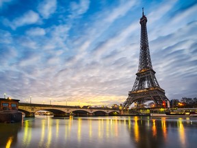 Watch sunrise over the Eiffel Tower in Paris, France.