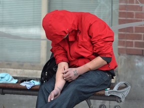 The British Columbia government is expected to release the latest statistics today around illicit drug overdose deaths. A man injects himself at a bus shelter in Vancouver's Downtown Eastside, Monday, Dec.19, 2016. The number of overdose deaths related to illicit drugs in British Columbia leapt to 755 by the end of November, a more than 70-per-cent jump over the number of fatalities recorded during the same time period last year.