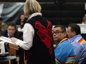 Regional Chief Shane Gottfriedson (centre) looks on as Carolyn Bennett, Minister of Indigenous and Northern Affairs, speaks at the Assembly of First Nations' annual general meeting at the Songhees Wellness Centre in Victoria, B.C.