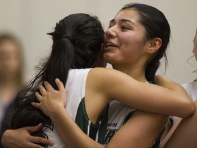 Lord Tweedsmuir Panthers #4 Shelvin Grewal ( R ) is congratulated by teammate #6 Ali Norris ( L ) after scoring the winning basket against the Riverside Rapids in the BC senior Girls AA basketball championships at the LEC Langley March 03 2016.