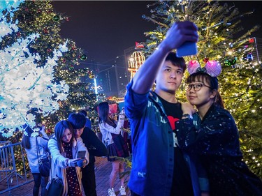 Crowds of people celebrate Christmas at shopping area in Central where is full of festive decorations on December 24, 2016 in Hong Kong.