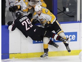 Defenceman Jordan Wharrie, earlier this season with the Brandon Wheat Kings, lays a hit on Vancouver Giants winger Tristyn DeRoose in a Dec. 2 WHL game at the Langley Events Centre. Wharrie and DeRoose are now teammates, since Wharrie was dealt to Vancouver at the Jan. 10 league trade deadline.