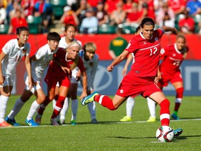 Christine Sinclair kicks the go-ahead goal on a penalty kick in the final minutes against China at the FIFA Women's World Cup in 2015.