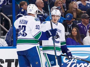Jayson Megna of the Canucks celebrates one of his two goals with teammate Henrik Sedin.  December 8, 2016 in Tampa, Florida.