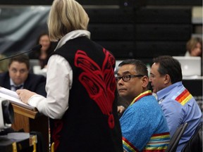 Regional Chief Shane Gottfriedson (centre) looks on as Carolyn Bennett, Minister of Indigenous and Northern Affairs, speaks at the Assembly of First Nations' annual general meeting at the Songhees Wellness Centre in Victoria, B.C.