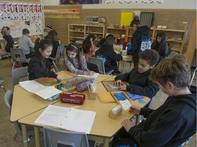 Children work on projects in a Montessori class at Miller Park Community School in Coquitlam.