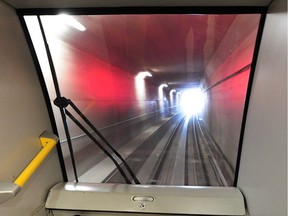 An Evergreen Line train on a pre-operational tour nears the end of the tunnel section.