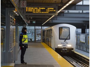 An attendant watches a SkyTrain arrive at the Coquitlam Central Station on the new Evergreen Line in Coquitlam on Dec. 2.