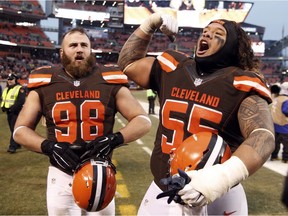 Cleveland Browns nose tackle Danny Shelton (55) and Jamie Meder (98) celebrate after a win over San Diego Chargers in an NFL football game, Saturday, Dec. 24, 2016, in Cleveland.