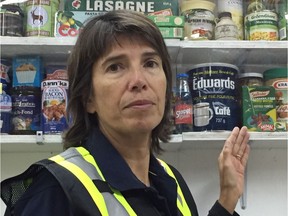 Ariela Friedmann, Director of Communications at the Greater Vancouver Food Bank. She is pointing to the 'food museum' in the warehouse where food that is very old or questionable for consumption is displayed.
