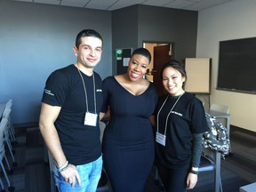 Symone Sanders, cente, poses Sunday in Vancouver with with local student activists Diego Cardona Ospina, left, and Reyna Joyce Villasin. Denise Ryan/PNG
