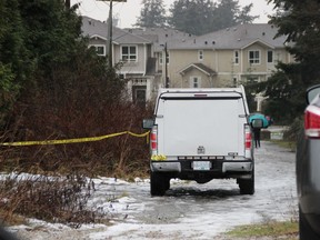 Delta police on the scene near  84th Avenue and Delsom Crescent in Delta, B.C., on Thursday, December 29, 2016. Police were alerted to a body found in a greenbelt.