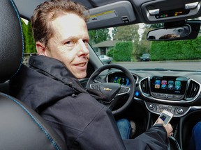 Trevor Weimer behind the wheel of his new Chevy Volt.